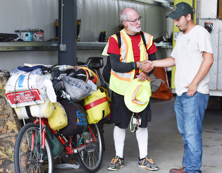 Man Traveling Country Stops At Local Fire Station
