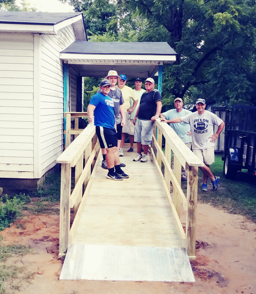 DHS Football Players Help Methodist Men Construct Handicap Ramp