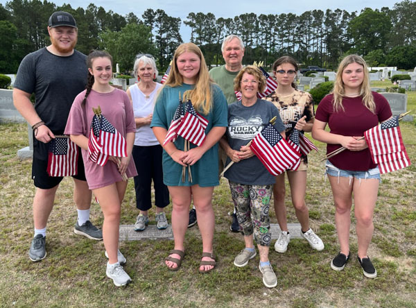 Volunteers Place Flags On Graves of Veterans